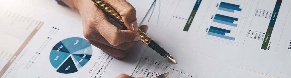 Two people looking at financial documents.