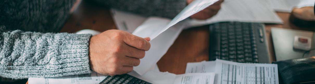 A man looking at some paperwork.