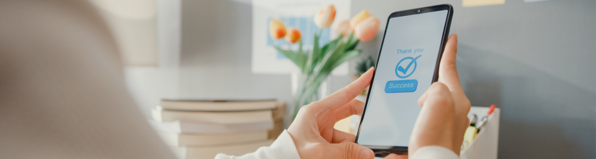 A woman using her phone for online banking.