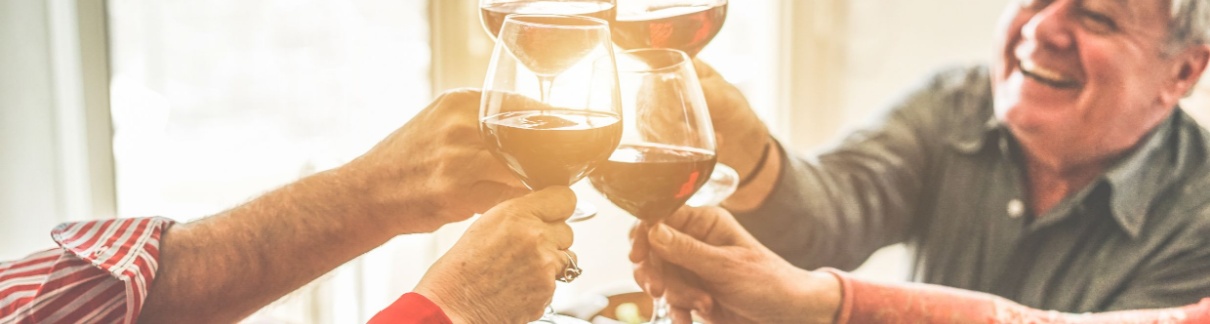 A group of friends cheering with wine.