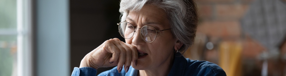 A woman reading a letter.