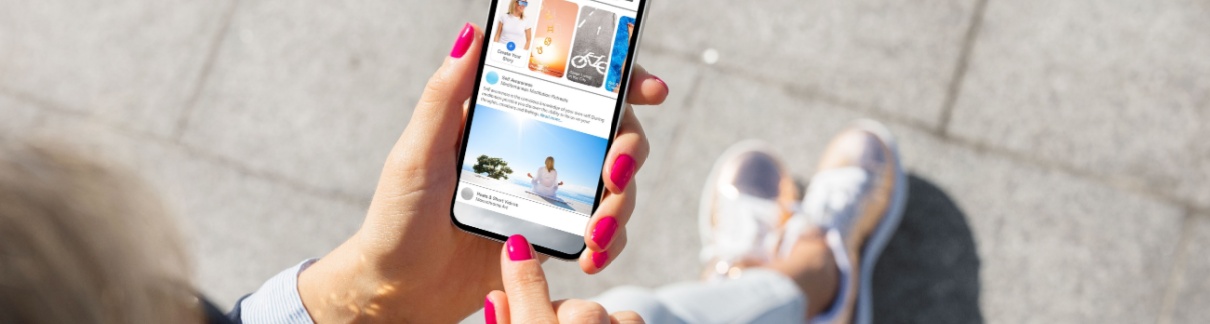 A woman looking at social media on her phone.