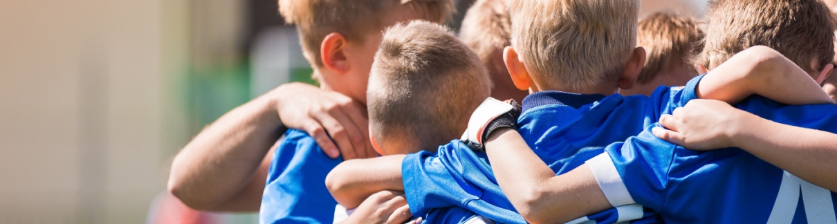 A group of children ready to play a sports game.