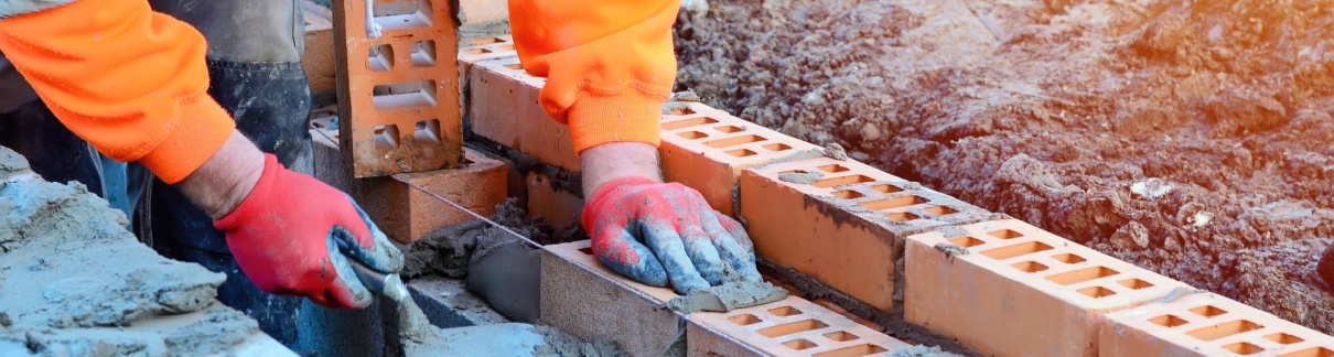 A bricklayer working on a construction site.