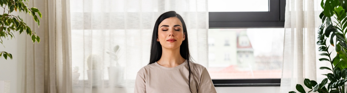 A woman meditating.
