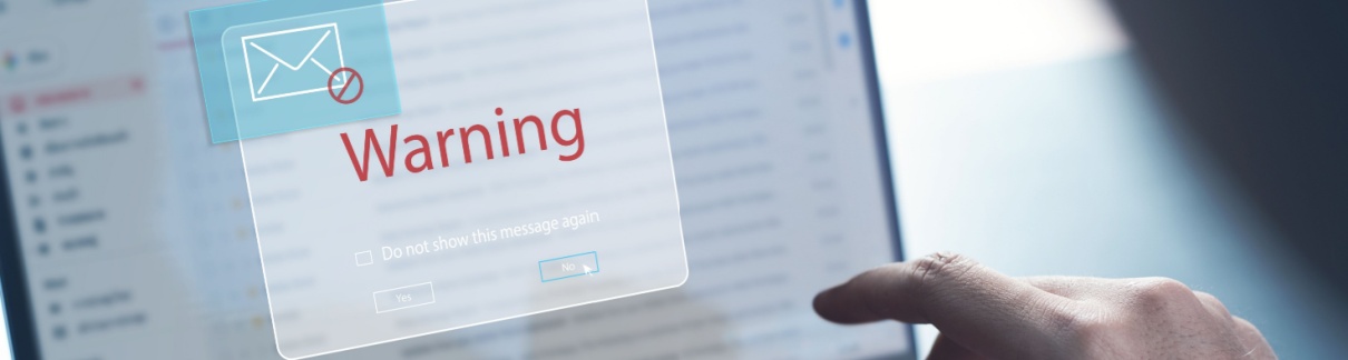 An email warning message on a laptop.
