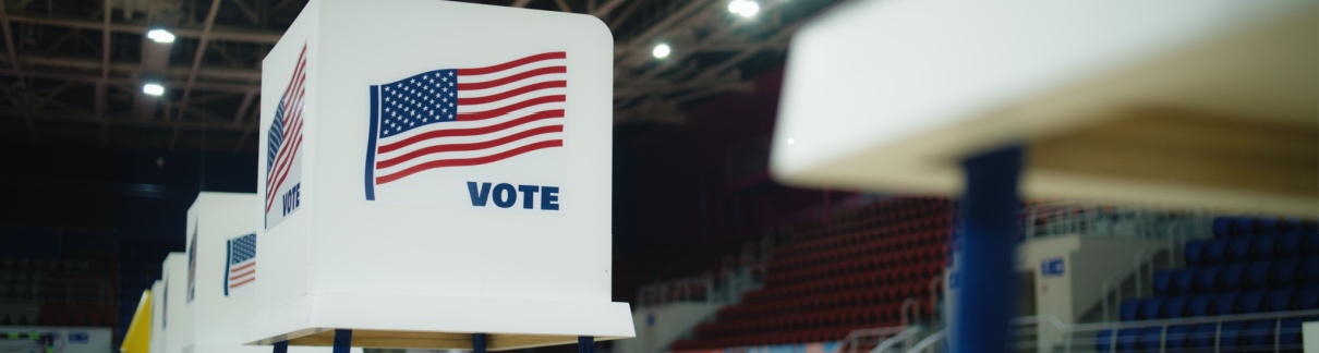 A voting booth with an American flag.