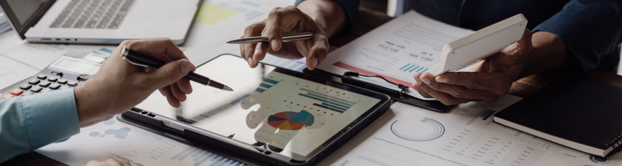 Business people looking at documents in an office.
