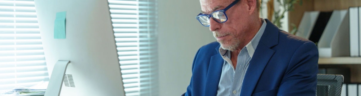 A man working at an office desk.