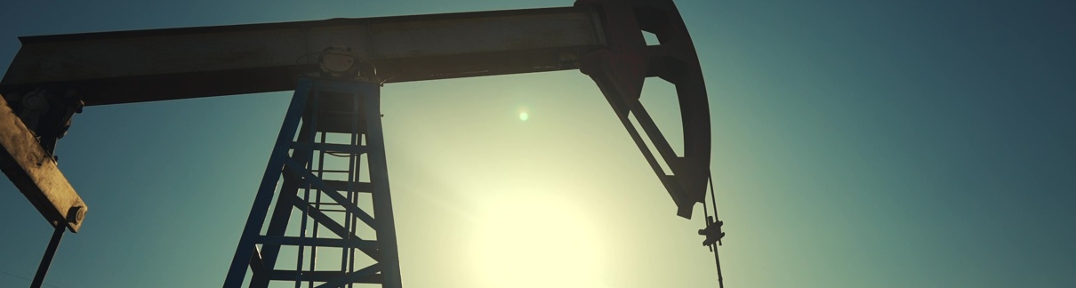 A silhouette of an oil pump.