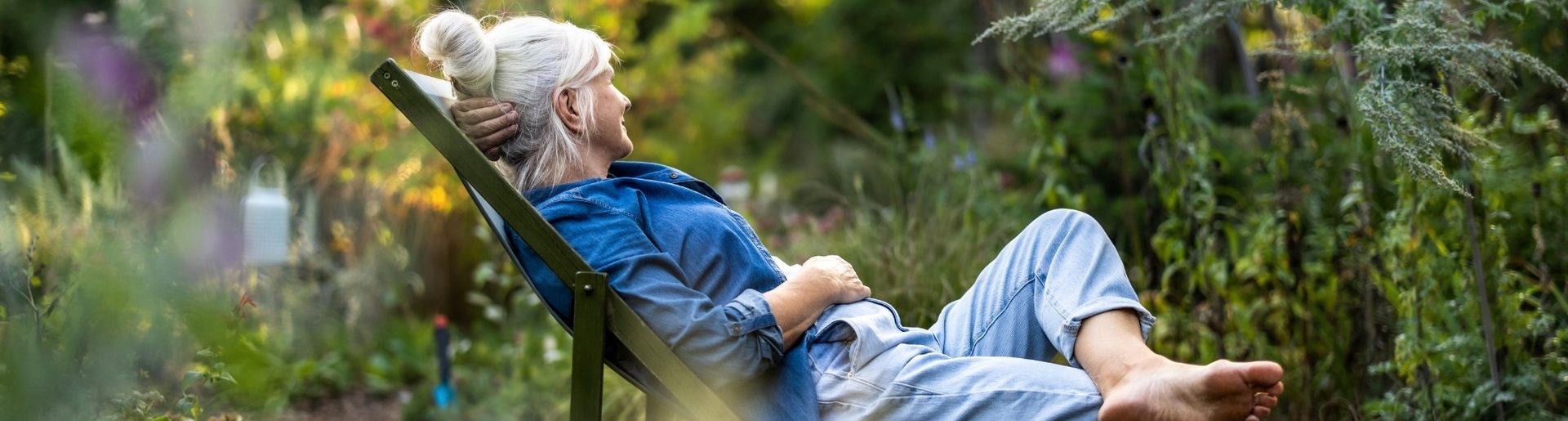 A woman relaxing in a garden.