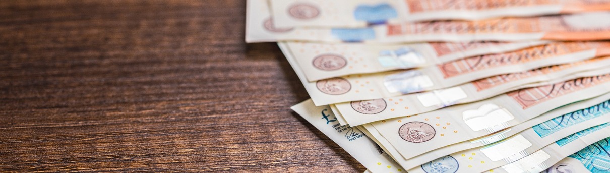 UK bank notes on a table.