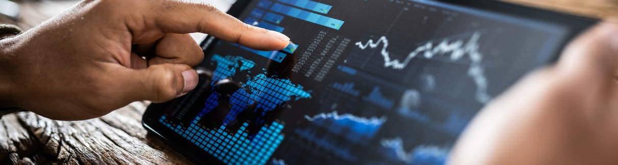 A person reviewing investment performance on a tablet.